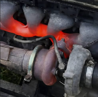 Red-hot turbocharger showing the need for high temp gasket material.