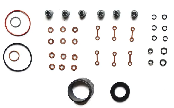 A complete valve cover gasket replacement kit including main seal, spark plug tube seals, and bolt grommets.
