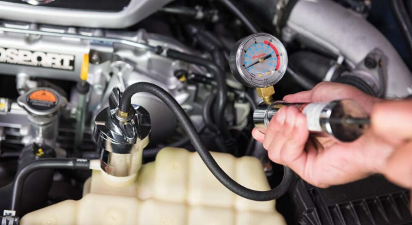 Using a cooling system pressure tester to find internal engine leaks.
