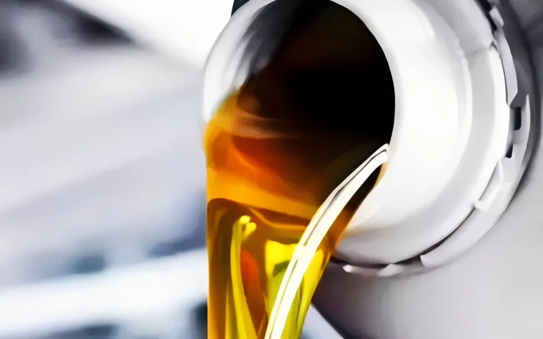 Pouring the best oil for diesel engines into a heavy-duty commercial truck.