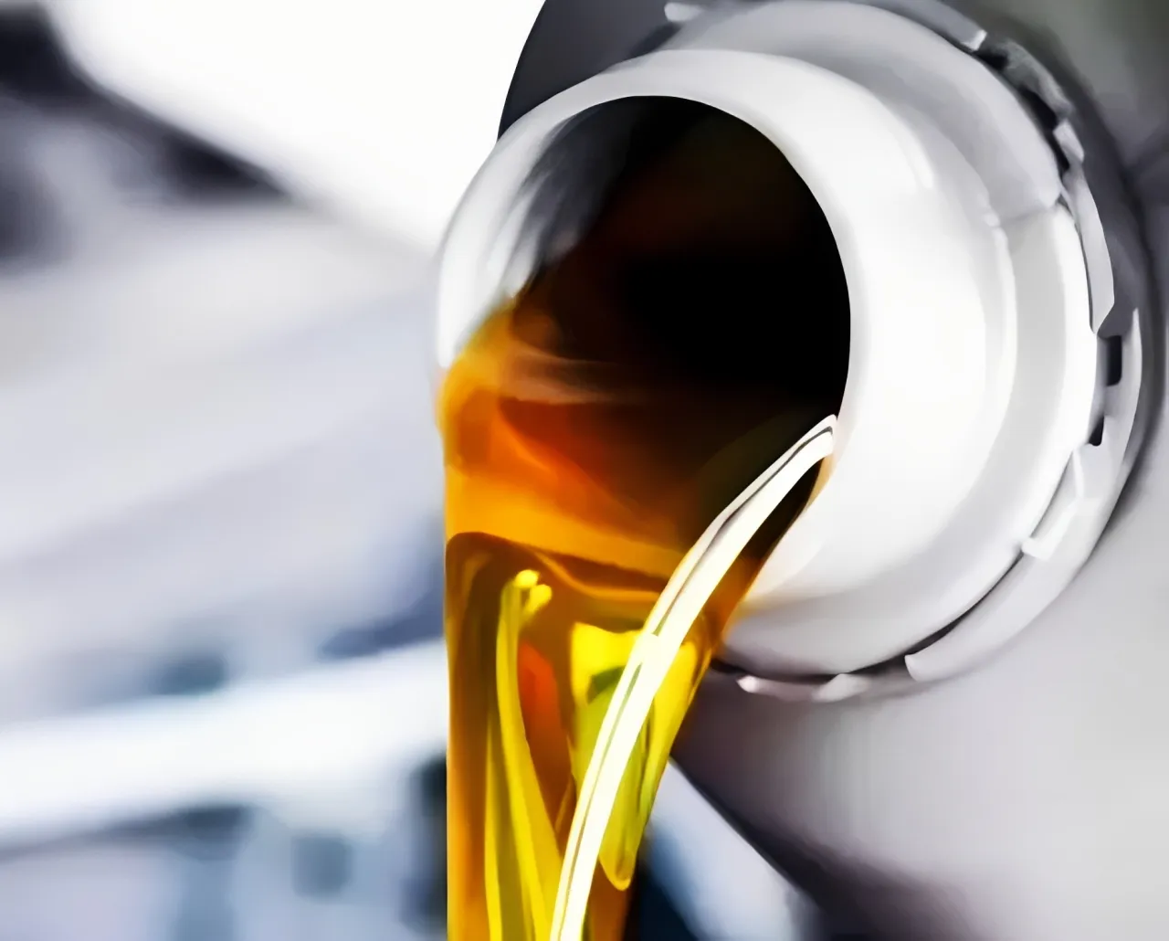 Pouring the best oil for diesel engines into a heavy-duty commercial truck.