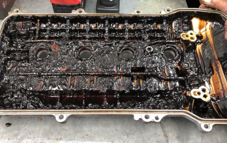 Engine block showing oil leak from the filter housing area.