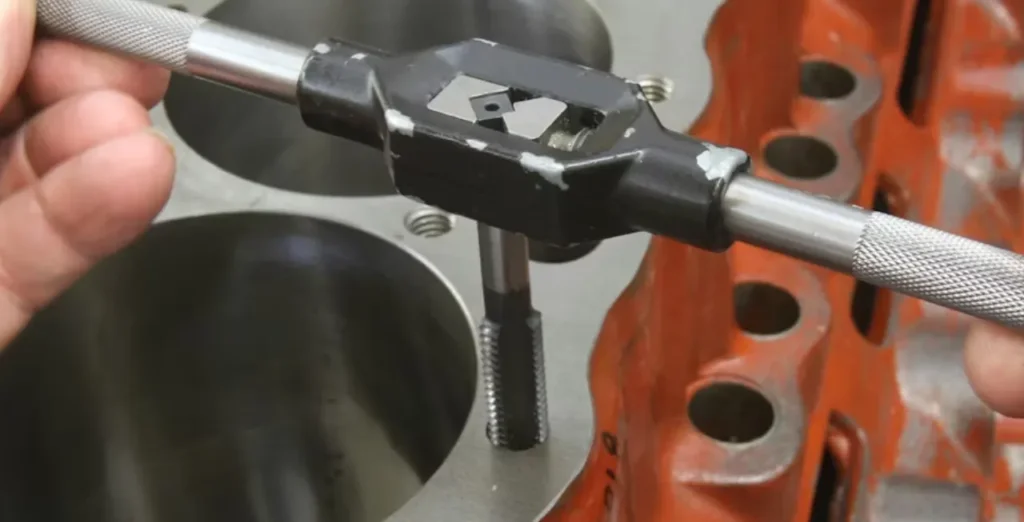 Cleaning blind head bolt holes prevents hydraulic lock during head gasket repair time.