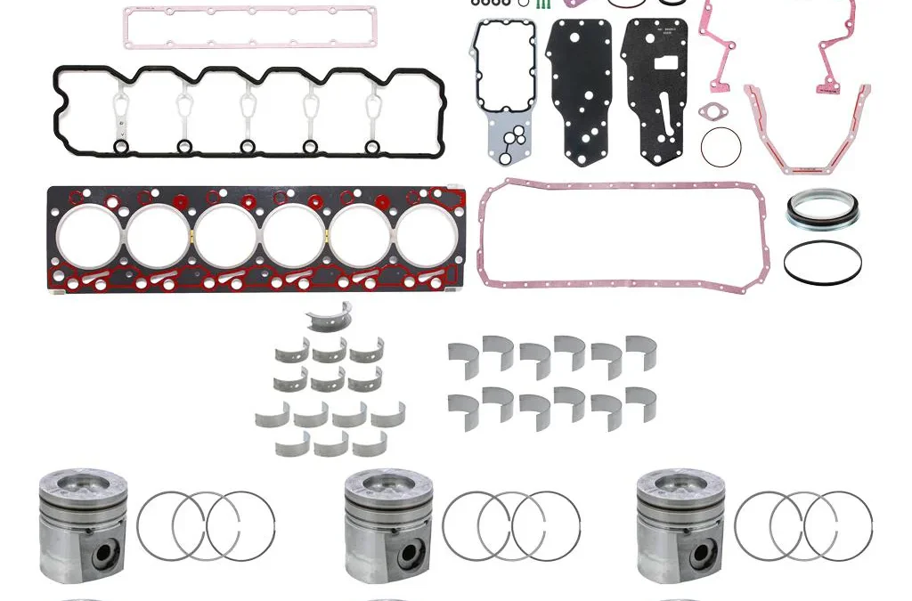 Complete 12 Valve Cummins 6BT overhaul rebuild kit layout including pistons, rings, and gaskets.