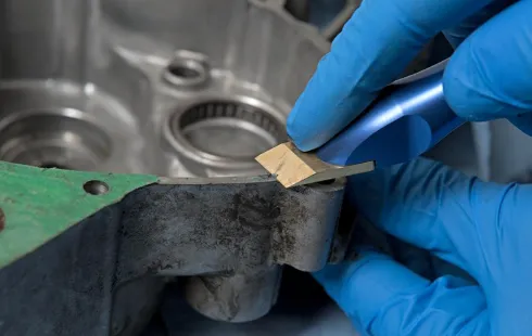 Professional process of cleaning throttle body gasket surfaces.