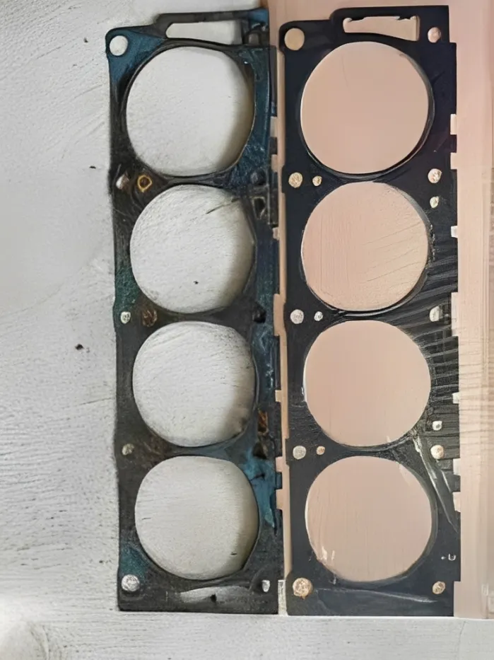 Comparing cheap paper gaskets to premium metal-core intake manifold gaskets.