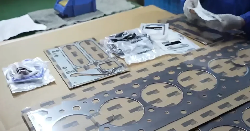 Professional VP GASKET Multi-Layer Steel head gasket and heavy-duty engine overhaul kit displayed on a mechanic's workbench.2026 Ram 2500