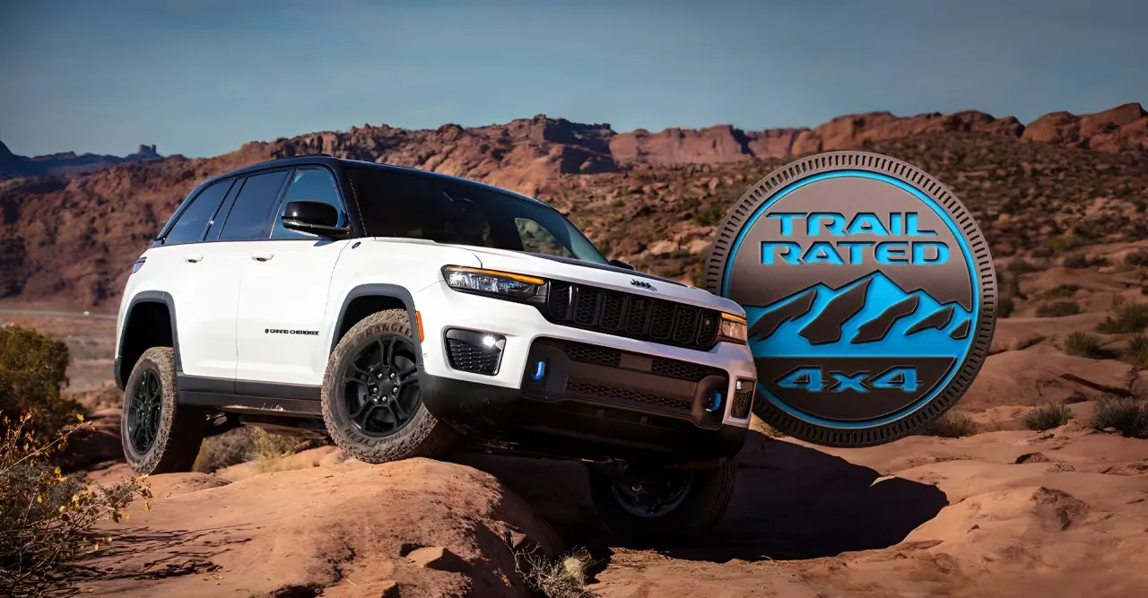 Exterior front view of the 2025 Jeep Grand Cherokee Laredo on a dirt trail