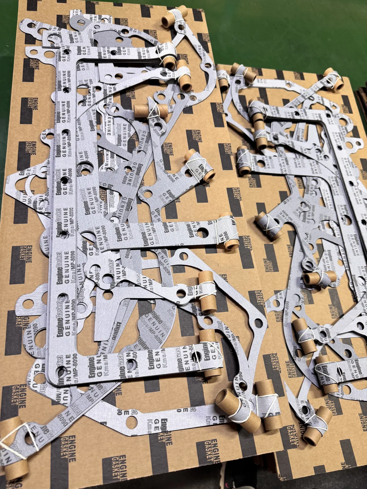 Gasket kit components on backing boards