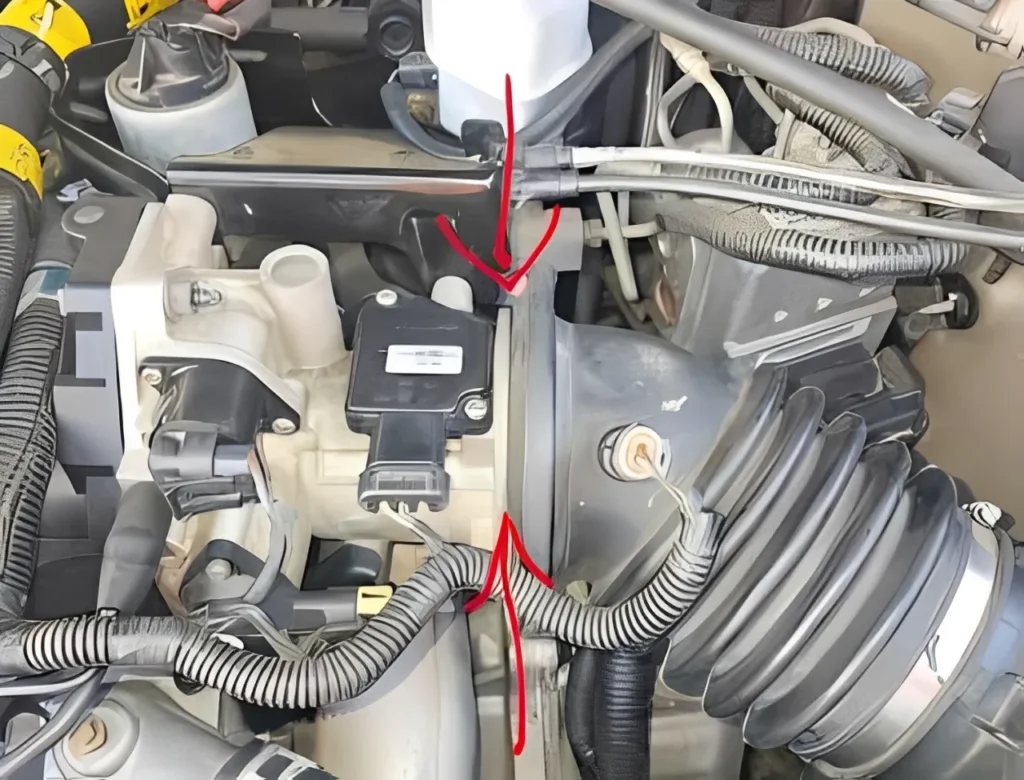 Low-pressure smoke test locating a throttle body gasket leak.